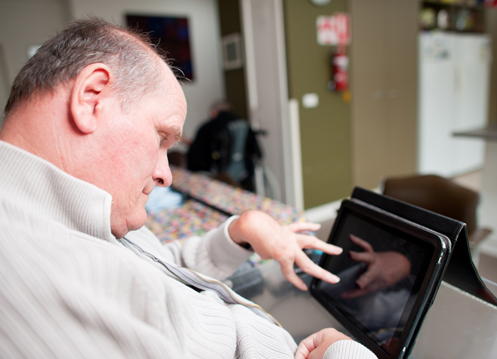 Disabled man using a computer.