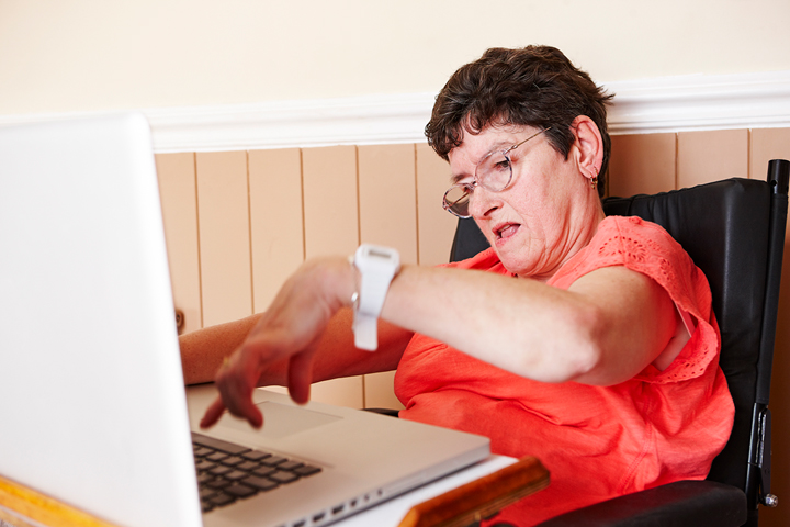 Disabled woman using a computer.